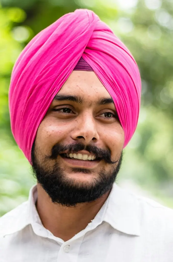 An employee smiling on a phone call
