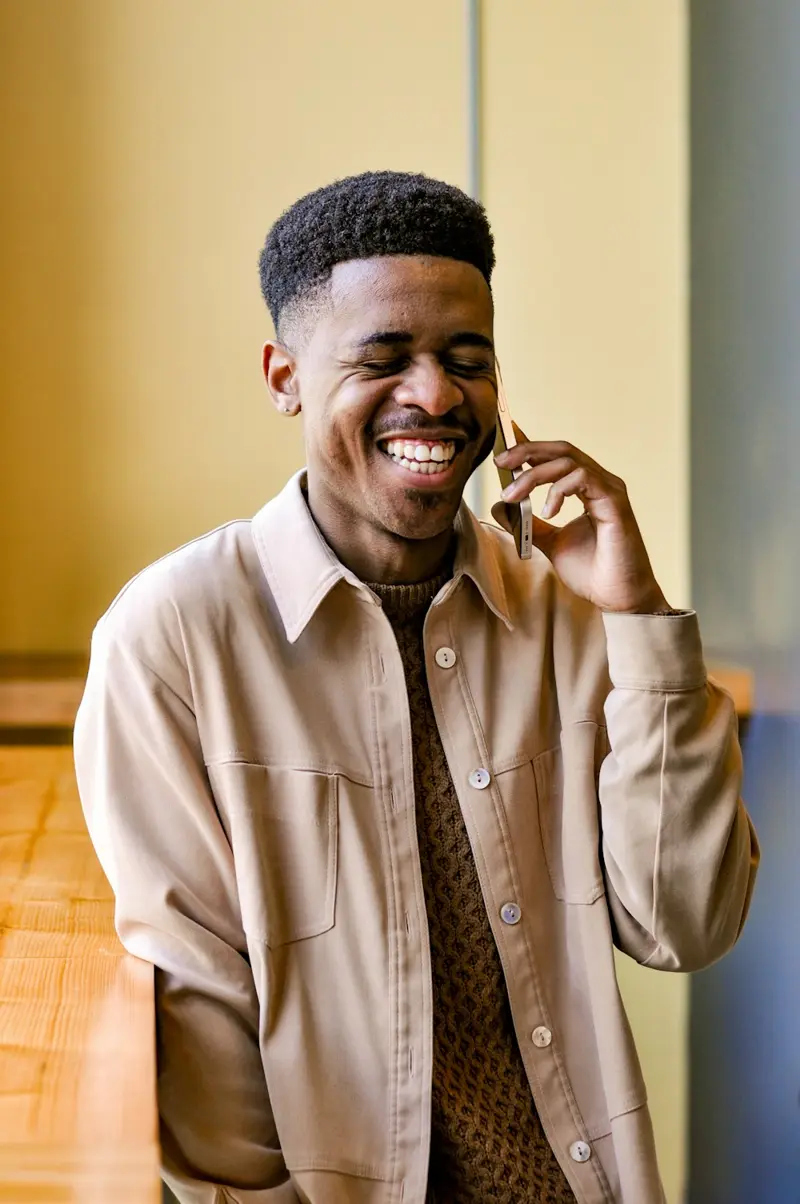 An employee smiling on a phone call